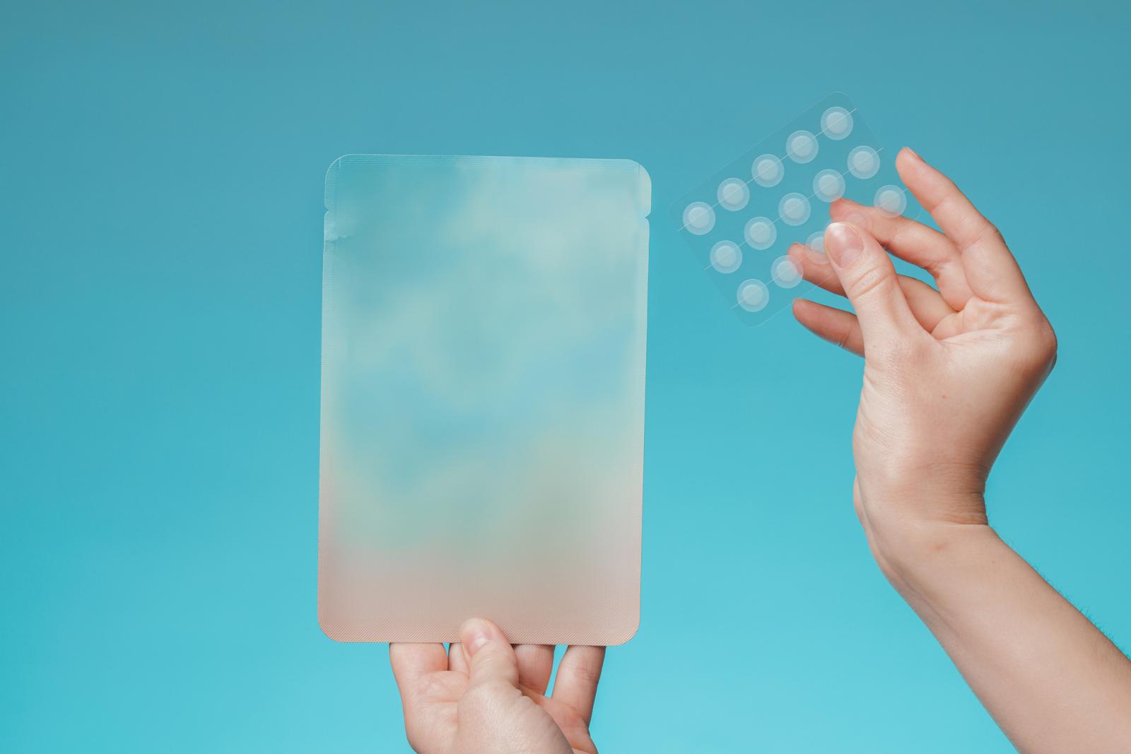 girl-with-acne-stick-round-acne-patch-on-her-cheek