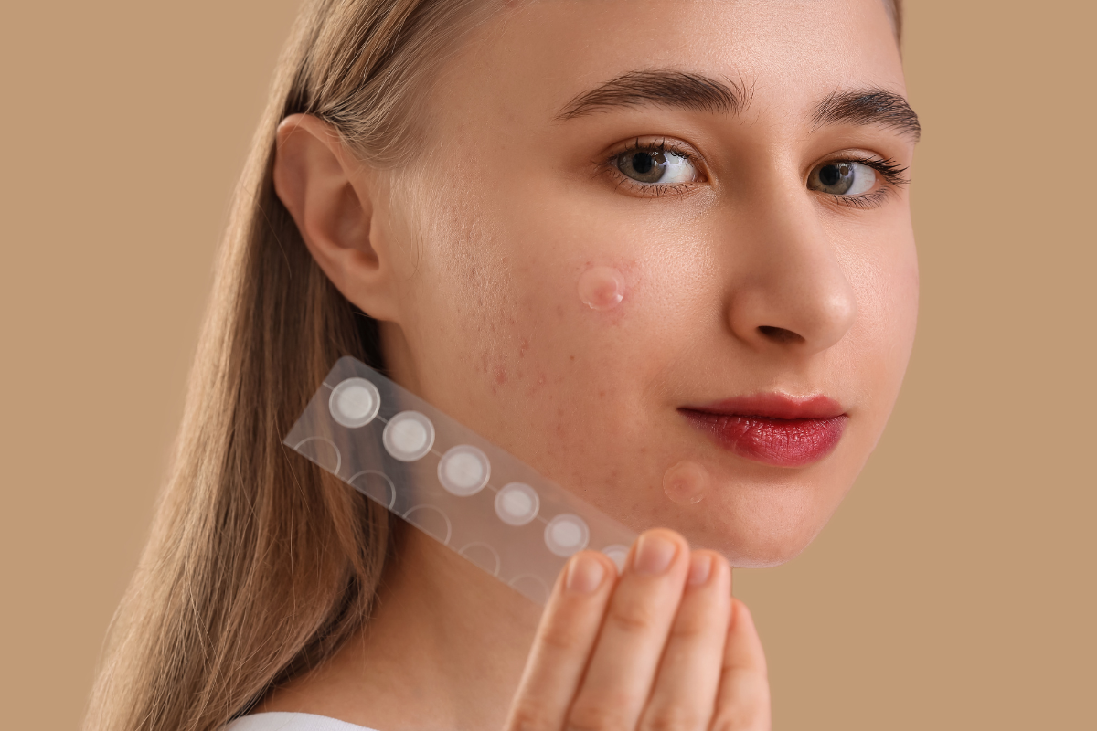 woman-holding-a-strip-of-pimple-patches
