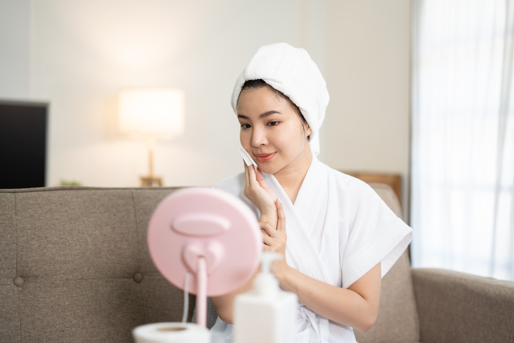 woman-smiling-with-cream-on-her-cheek
